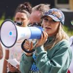 Soldotna Chamber of Commerce Executive Director Maddy McElrea speaks during a color run held as part of during the Levitt AMP Soldotna Music Series on Wednesday, June 7, 2023, at the Kenai National Wildlife Refuge Visitors Center in Soldotna, Alaska. (Jake Dye/Peninsula Clarion)
