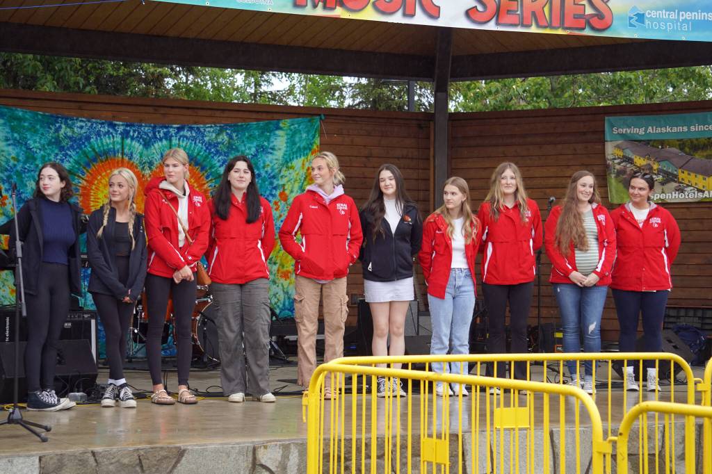 Members of the Kenai Central High School cheerleading team are awarded a legislative citation ahead of the start of the Soldotna Music Series performance on Wednesday, June 21, 2023, at Soldotna Creek Park in Soldotna, Alaska. (Jake Dye/Peninsula Clarion)