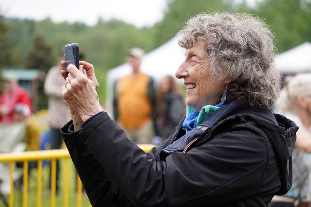 Attendees gather before the stage as Connie Brannocks Tiny House of Funk performs during the Soldotna Music Series at Soldotna Creek Park in Soldotna, Alaska, on Wednesday, June 21, 2023. (Jake Dye/Peninsula Clarion)
