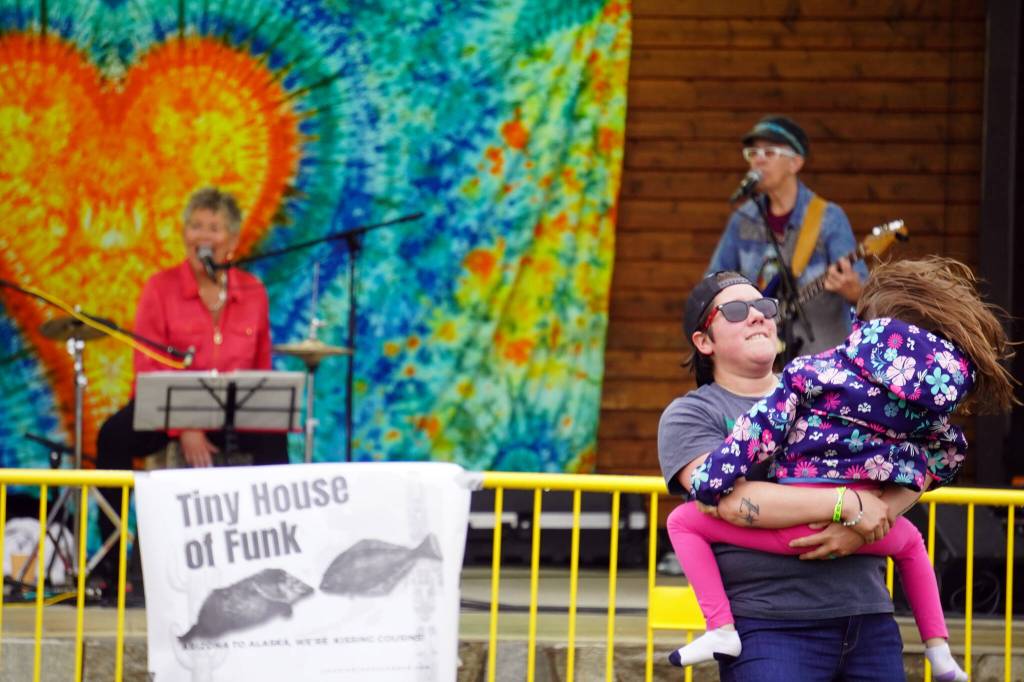 Attendees dance before the stage as Connie Brannocks Tiny House of Funk performs during the Soldotna Music Series at Soldotna Creek Park in Soldotna, Alaska, on Wednesday, June 21, 2023. (Jake Dye/Peninsula Clarion)