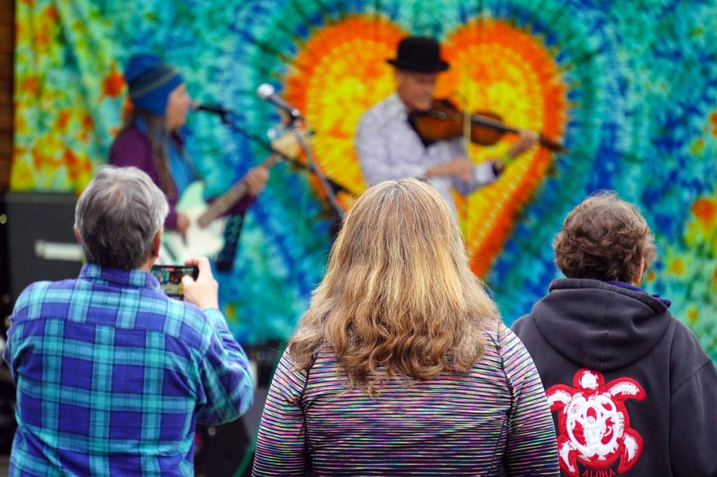 Attendees gather before the stage as Connie Brannocks Tiny House of Funk performs during the Soldotna Music Series at Soldotna Creek Park in Soldotna, Alaska, on Wednesday, June 21, 2023. (Jake Dye/Peninsula Clarion)