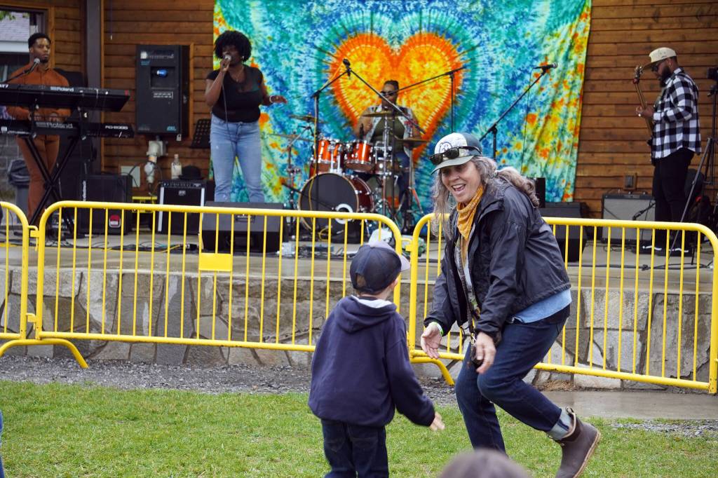 Attendees dance before the stage as Wasabi Black performs during the Soldotna Music Series at Soldotna Creek Park in Soldotna, Alaska, on Wednesday, June 21, 2023. (Jake Dye/Peninsula Clarion)