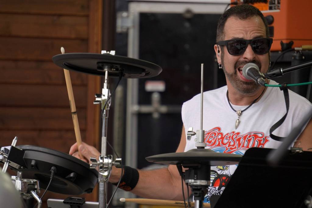 Mark Gage performs as part of Hot Mess at Soldotna Creek Park in Soldotna, Alaska, on Wednesday, Aug. 23, 2023. (Jake Dye/Peninsula Clarion)