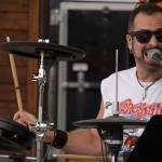 Mark Gage performs as part of Hot Mess at Soldotna Creek Park in Soldotna, Alaska, on Wednesday, Aug. 23, 2023. (Jake Dye/Peninsula Clarion)