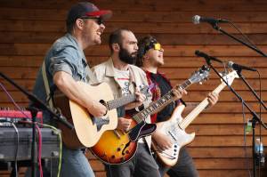 Blackwater Railroad Companys Tyson Davis, Matt Faubion and Ben Sayers perform during the Levitt AMP Soldotna Music Series on Wednesday, June 7, 2023, at Soldotna Creek Park in Soldotna, Alaska. (Jake Dye/Peninsula Clarion)