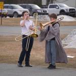 A trombone player in the robes of a jedi warms up during Pops in the Parking Lot at Kenai Central High School in Kenai, Alaska, on Thursday, May 4, 2023. (Jake Dye/Peninsula Clarion)