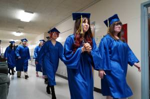 Students of Kenai Alternative High School proceed into a graduation ceremony in the schools gym in Kenai, Alaska, on Tuesday, May 14, 2024. (Jake Dye/Peninsula Clarion)