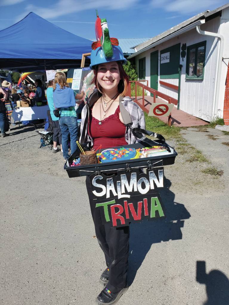 Caroline Gatling with Cook Inletkeeper educates festival-goers on salmon trivia during Salmonfest on Sunday, Aug. 4, 2024, in Ninilchik, Alaska. (Delcenia Cosman/Homer News)