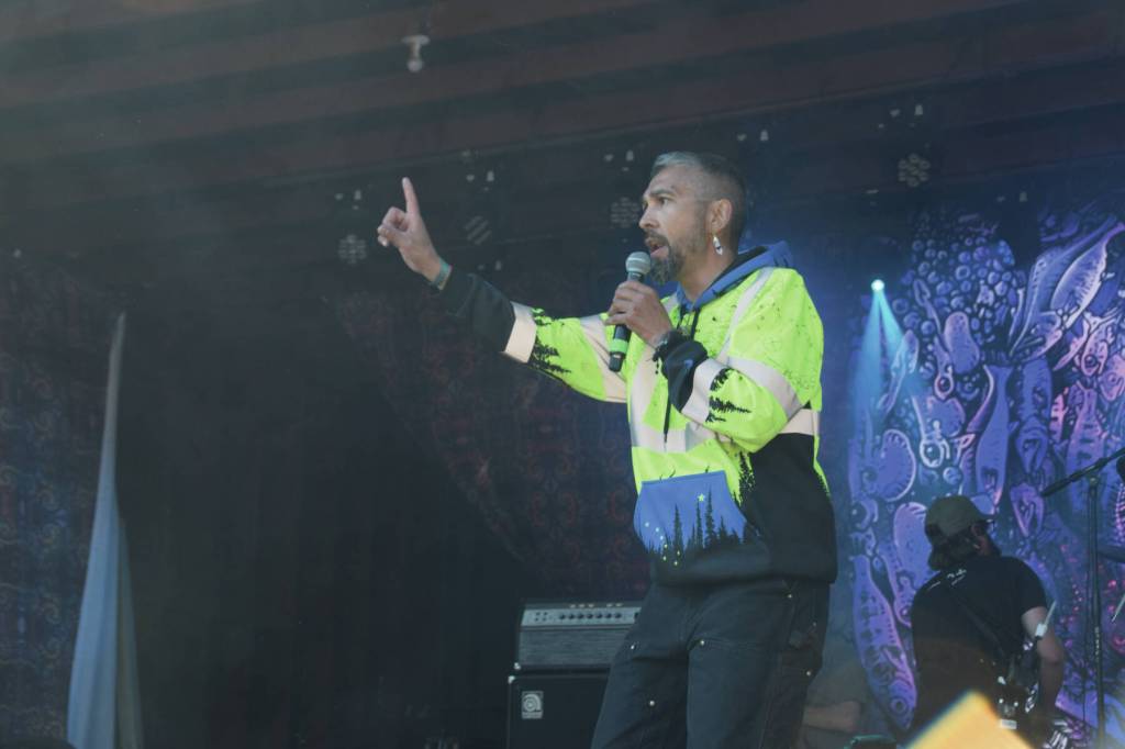 Quentin The Kid Simeon gives a poetry slam performance of Mother Hugger at the River Stage Amphitheater during Salmonfest on Sunday, Aug. 4, 2024, in Ninilchik, Alaska. (Delcenia Cosman/Homer News)