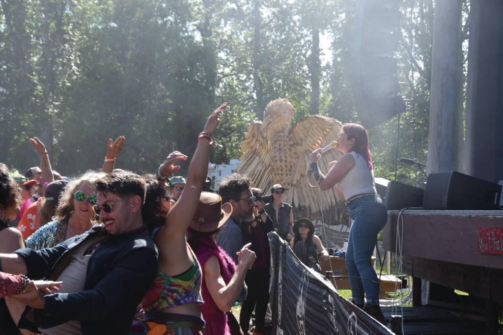 Concertgoers dance at Glitterfoxs Salmonfest performance at the River Stage Amphitheater on Sunday, Aug. 4, 2024, in Ninilchik, Alaska. (Delcenia Cosman/Homer News)
