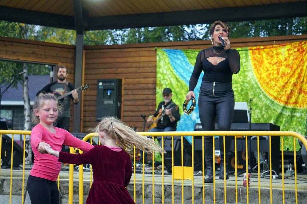 Children dance as Ellie and the Echoes perform the last night of the Levitt AMP Soldotna Music Series at Soldotna Creek Park in Soldotna, Alaska, on Wednesday, Aug. 28, 2024. (Jake Dye/Peninsula Clarion)