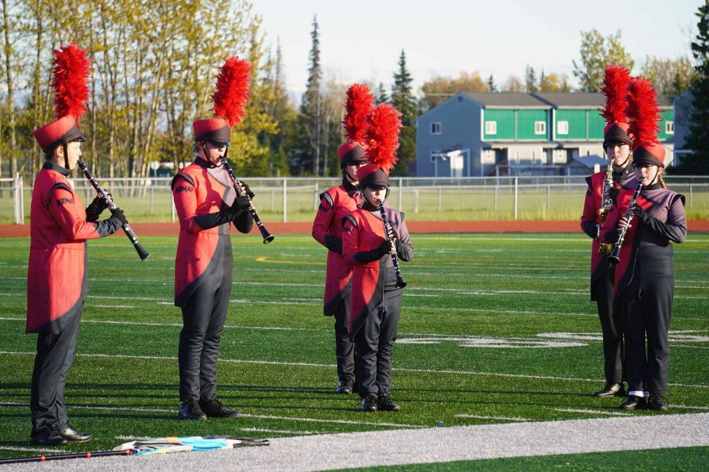 The Kenai Central High School Marching Band performs Snakes and Songbirds: The Music of the Hunger Games during the Kenai Marching Showcase at Ed Hollier Field in Kenai, Alaska, on Saturday, Sept. 21, 2024. (Jake Dye/Peninsula Clarion)