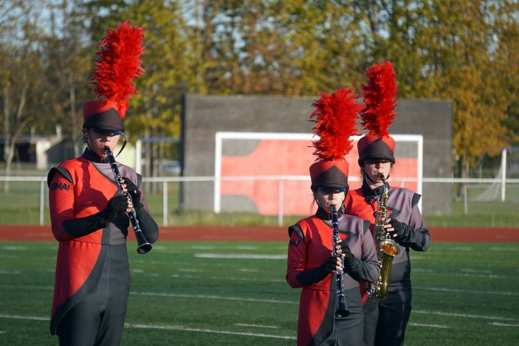 The Kenai Central High School Marching Band performs Snakes and Songbirds: The Music of the Hunger Games during the Kenai Marching Showcase at Ed Hollier Field in Kenai, Alaska, on Saturday, Sept. 21, 2024. (Jake Dye/Peninsula Clarion)