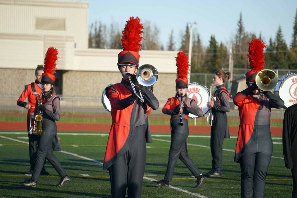 The Kenai Central High School Marching Band performs Snakes and Songbirds: The Music of the Hunger Games during the Kenai Marching Showcase at Ed Hollier Field in Kenai, Alaska, on Saturday, Sept. 21, 2024. (Jake Dye/Peninsula Clarion)