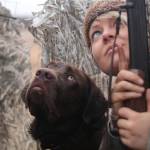 Rigby and Christine Cunningham patiently waiting in a duck blind, both watching a flock of teal high overhead. (Photo by Steve Meyer)