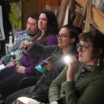 Robyn Chai, center right, directs Intuition Salons shadow cast of Rocky Horror Picture Show during a rehearsal in Kenai, Alaska, on Monday, Oct. 21, 2024. (Jake Dye/Peninsula Clarion)
