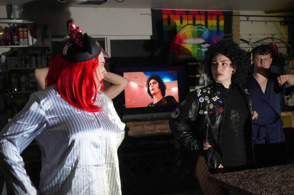The cast of Intuition Salons shadow cast of Rocky Horror Picture Show rehearse in Kenai, Alaska, on Monday, Oct. 21, 2024. (Jake Dye/Peninsula Clarion)