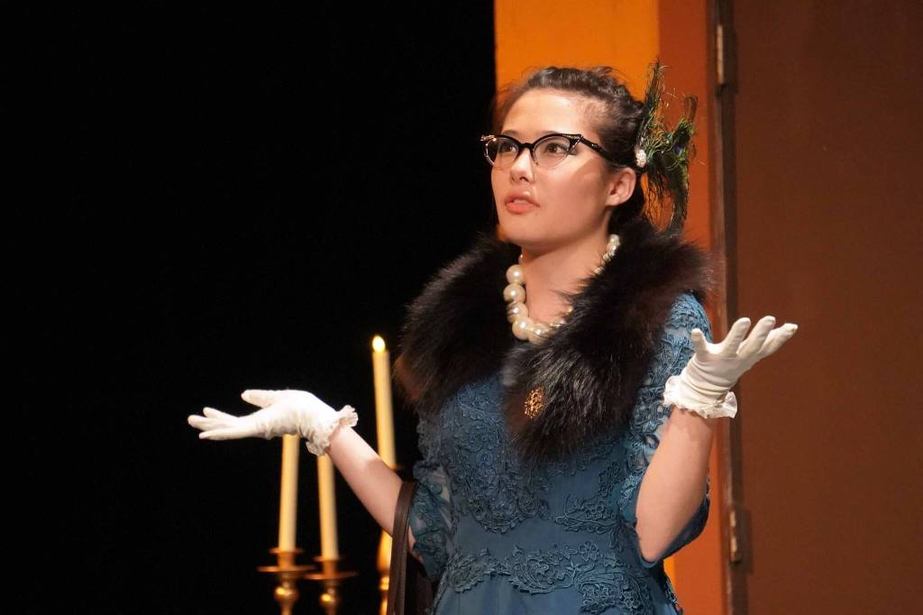 Nia Mulholland-Kim, as Mrs. Peacock, rehearses Seward High School Theatre Collectives Clue at Seward High School in Seward, Alaska, on Thursday, Nov. 7, 2024. (Jake Dye/Peninsula Clarion)