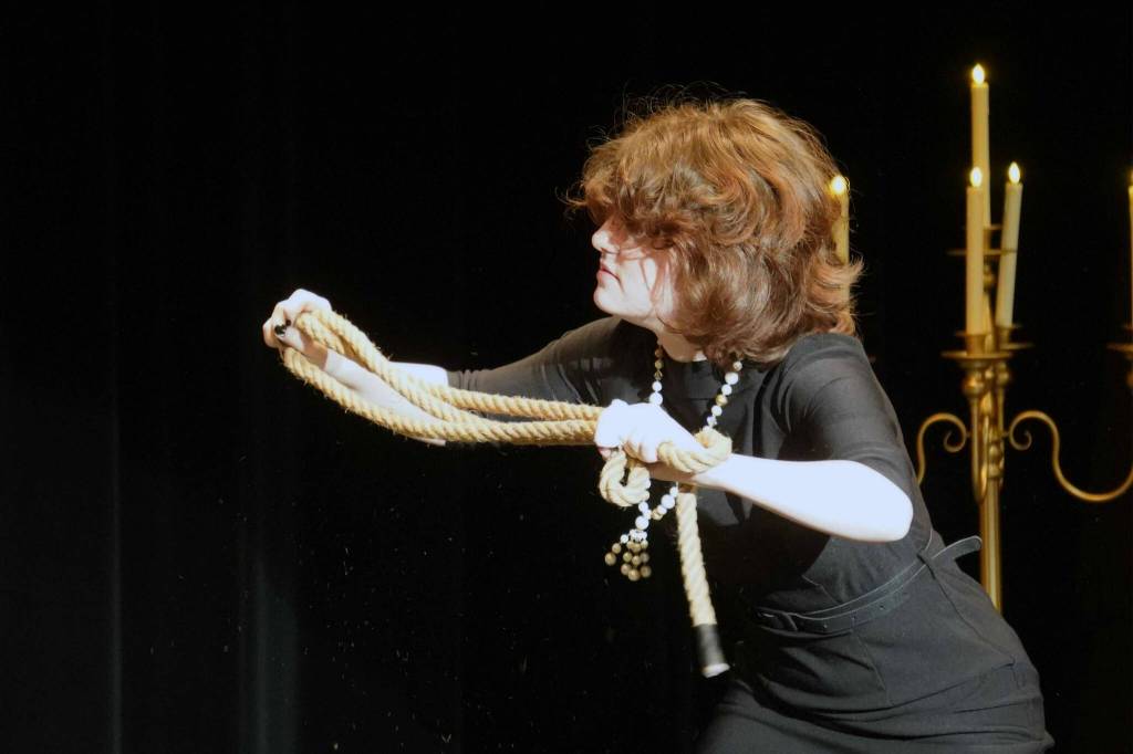 Lilly Mooter, as Mrs. White, rehearses Seward High School Theatre Collectives Clue at Seward High School in Seward, Alaska, on Thursday, Nov. 7, 2024. (Jake Dye/Peninsula Clarion)