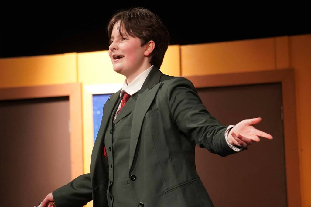Evelyn Bukac, as Mr. Green, rehearses Seward High School Theatre Collectives Clue at Seward High School in Seward, Alaska, on Thursday, Nov. 7, 2024. (Jake Dye/Peninsula Clarion)
