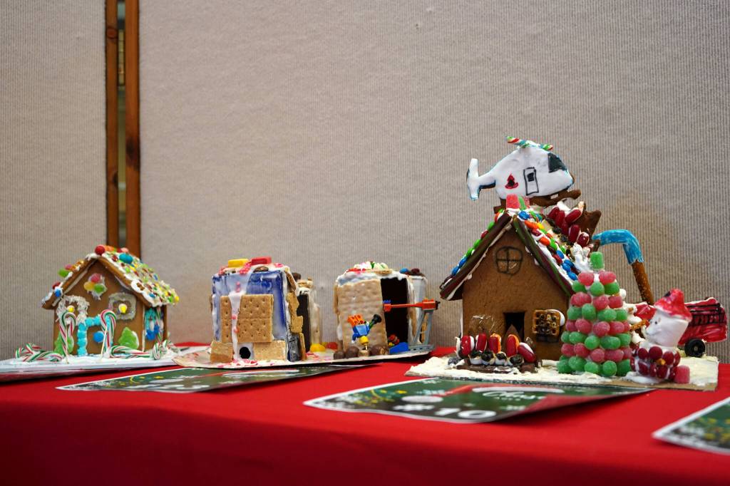 Gingerbread houses constructed by Ember, 6; Hogarth, 7; Chase, 8; and Gus, 7, are displayed in the Kenai Chamber of Commerces 12th Annual Gingerbread House Contest at the Kenai Chamber of Commerce and Visitor Center in Kenai, Alaska, on Wednesday, Nov. 20, 2024. (Jake Dye/Peninsula Clarion)