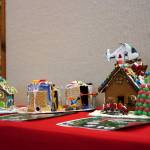 Gingerbread houses constructed by Ember, 6; Hogarth, 7; Chase, 8; and Gus, 7, are displayed in the Kenai Chamber of Commerces 12th Annual Gingerbread House Contest at the Kenai Chamber of Commerce and Visitor Center in Kenai, Alaska, on Wednesday, Nov. 20, 2024. (Jake Dye/Peninsula Clarion)