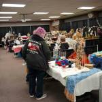 Shoppers browse wares at the 33rd Annual Holiday Bazaar at the Soldotna Regional Sports Complex in Soldotna, Alaska, on Friday, Nov. 22, 2024. (Jonas Oyoumick/Peninsula Clarion)