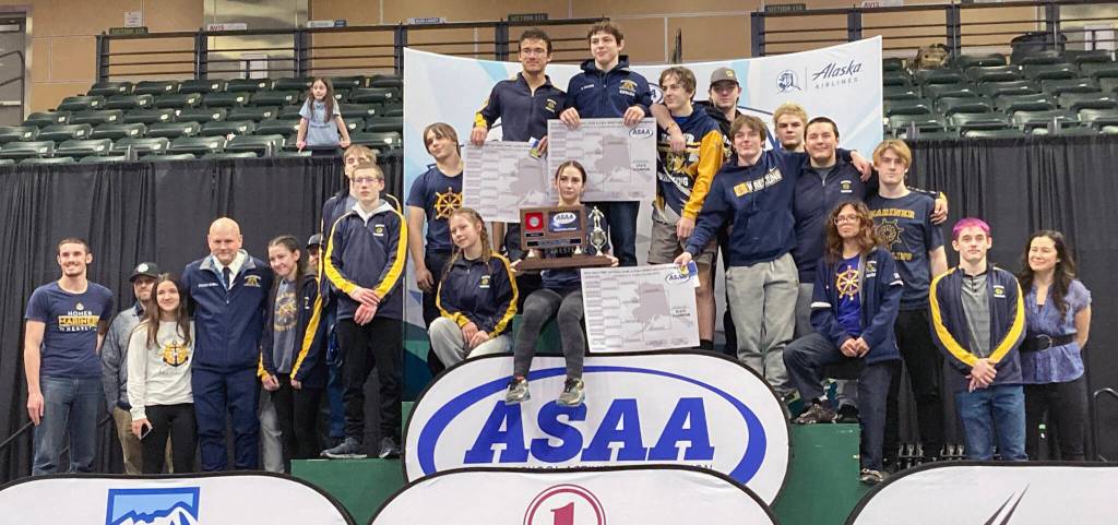 The Homer boys took second place at the Division II state wrestling tournament Saturday, Dec. 21, 2024, at the Alaska Airlines Center in Anchorage, Alaska. (Photo by Jeff Helminiak/Peninsula Clarion)