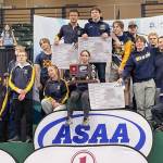 The Homer boys took second place at the Division II state wrestling tournament Saturday, Dec. 21, 2024, at the Alaska Airlines Center in Anchorage, Alaska. (Photo by Jeff Helminiak/Peninsula Clarion)