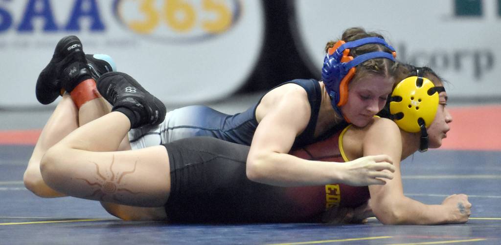 Soldotnas Mia Hannevold wrestles to a technical fall over Nevaeh George of Mt. Edgecumbe in the final at 114 pounds at the girls state wrestling tournament Saturday, Dec. 21, 2024, at the Alaska Airlines Center in Anchorage, Alaska. (Photo by Jeff Helminiak/Peninsula Clarion)