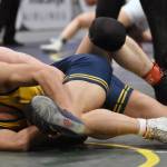 Homers Paul Minke (front) wrestles to a 12-4 major decision over Homers Justus Grimes in the final at 145 pounds at the Division II state wrestling tournament Saturday, Dec. 21, 2024, at the Alaska Airlines Center in Anchorage, Alaska. (Photo by Jeff Helminiak/Peninsula Clarion)