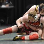 Kenai Centrals Daniel Steffensen wrestles to a 14-0 major decision against Homers Landyn Woods in the final at 152 pounds at the Division II state wrestling tournament Saturday, Dec. 21, 2024, at the Alaska Airlines Center in Anchorage, Alaska. (Photo by Jeff Helminiak/Peninsula Clarion)