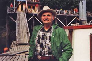 In the 1990s, Poopdeck Platt enjoys some sunshine in front of The Saltry, in Halibut Cove. (Photo courtesy of Ken Moore)