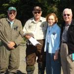Left to right: Tom Griffiths, former Denali National Park chief ranger and refuge volunteer; Rick Johnston, Kenai National Wildlife Refuge pilot/ranger; Rosalynn Carter and former President Jimmy Carter are photographed at Alaska Wildland Adventures Kenai Back Country Lodge beach, Skilak Lake, Kenai National Wildlife Refuge<ins>,</ins> <ins>Alaska</ins>. (Photo by Kirk Hoessle/courtesy)