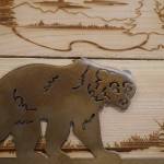 Signs crafted of wood and metal by Nikiski Middle/High School students are displayed during a meeting of the Kenai Peninsula Borough School Districts Board of Education in Soldotna, Alaska, on Monday, Feb. 3, 2025. (Jake Dye/Peninsula Clarion)