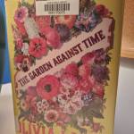 The Garden Against Time by Olivia Laing stands on a desk in the Homer News newsroom on Tuesday, Feb. 11, 2025, in Homer, Alaska. (Delcenia Cosman/Homer News)