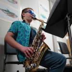 Soldotna Elementary School students perform in the halls during an art show and music fundraiser at Soldotna Elementary School in Soldotna, Alaska, on Thursday, Feb. 27, 2025. (Jake Dye/Peninsula Clarion)