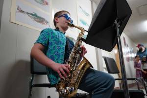 Soldotna Elementary School students perform in the halls during an art show and music fundraiser at Soldotna Elementary School in Soldotna, Alaska, on Thursday, Feb. 27, 2025. (Jake Dye/Peninsula Clarion)