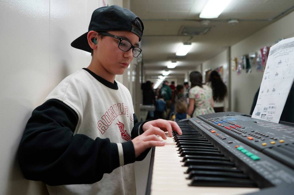 Soldotna Elementary School students perform in the halls during an art show and music fundraiser at Soldotna Elementary School in Soldotna, Alaska, on Thursday, Feb. 27, 2025. (Jake Dye/Peninsula Clarion)