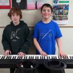 Soldotna Elementary School students perform in the halls during an art show and music fundraiser at Soldotna Elementary School in Soldotna, Alaska, on Thursday, Feb. 27, 2025. (Jake Dye/Peninsula Clarion)