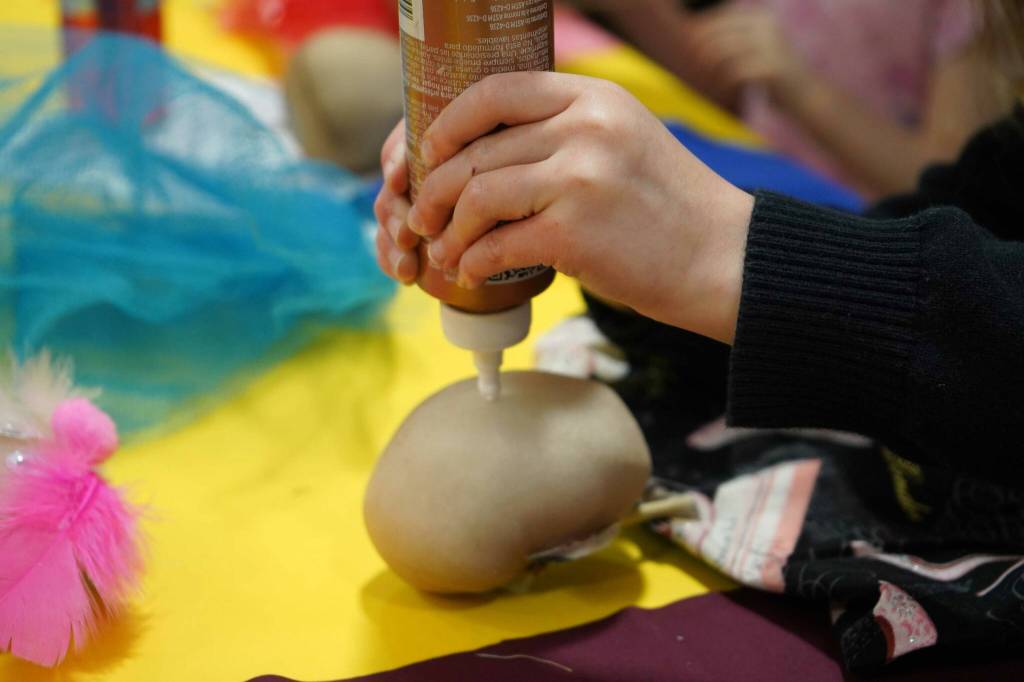 Students and families create puppets during a family art night hosted by Artist in Residence Shala Dobson at Kaleidoscope School of Arts and Science in Kenai, Alaska, on Thursday, Feb. 27, 2025. (Jake Dye/Peninsula Clarion)
