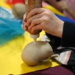 Students and families create puppets during a family art night hosted by Artist in Residence Shala Dobson at Kaleidoscope School of Arts and Science in Kenai, Alaska, on Thursday, Feb. 27, 2025. (Jake Dye/Peninsula Clarion)