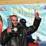 Tournament champion Zach Weimann holds up his first-place trophy during the 2025 Homer Winter King Salmon Tournament on Saturday. (Delcenia Cosman/Homer News)