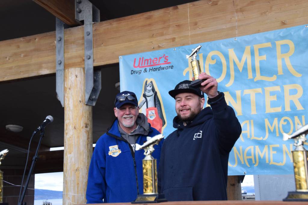 Brandon Kosht poses with his eighth place trophy during the 2025 Homer Winter King Salmon Tournament on Saturday, March 22, 2025, at the Deep Water Dock on the Homer Spit in Homer, Alaska. (Delcenia Cosman/Homer News)