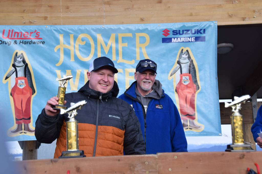 Kendall Soares holds up his ninth place trophy during the 2025 Homer Winter King Salmon Tournament on Saturday, March 22, 2025, at the Deep Water Dock on the Homer Spit in Homer, Alaska. (Delcenia Cosman/Homer News)