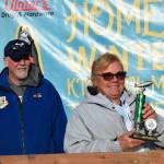 Kim Weimann (right) poses with her third-place trophy during the 2025 Homer Winter King Salmon Tournament on Saturday, March 22, 2025, at the Deep Water Dock on the Homer Spit in Homer, Alaska. (Delcenia Cosman/Homer News)