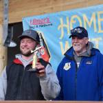 Jack Heinbold, who also won the white king prize, poses with his seventh place trophy during the 2025 Homer Winter King Salmon Tournament on Saturday, March 22, 2025, at the Deep Water Dock on the Homer Spit in Homer, Alaska. (Delcenia Cosman/Homer News)