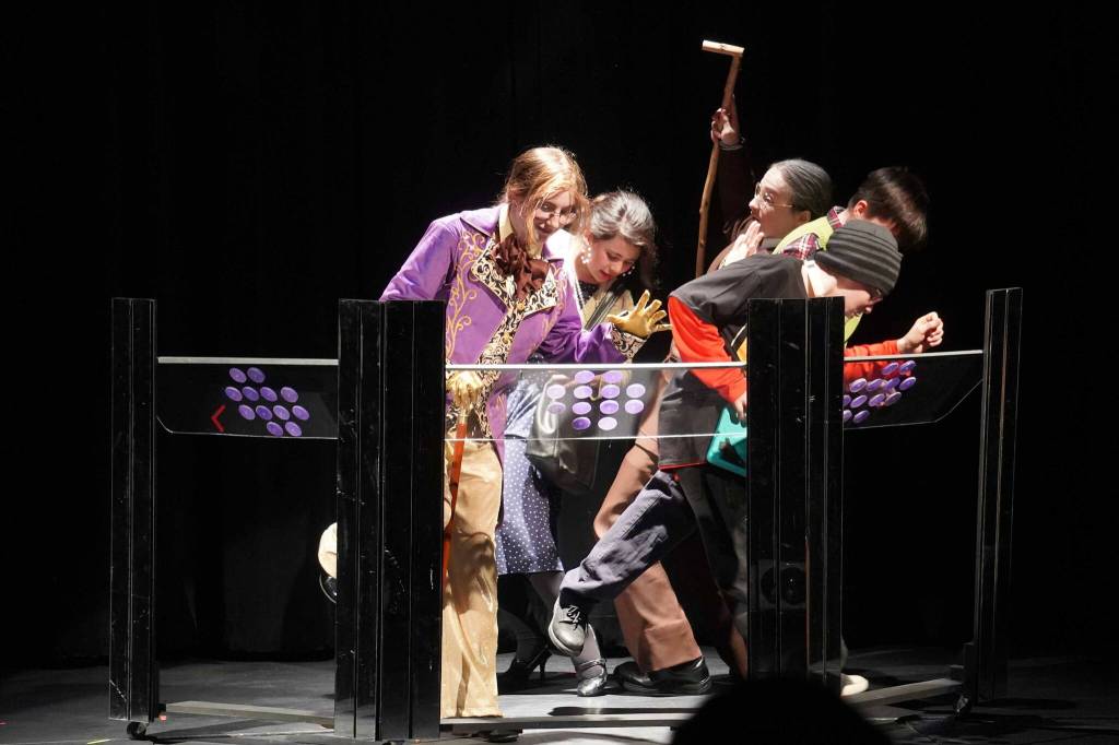 The cast of Seward High School Theatre Collectives Charlie and the Chocolate Factory rehearse on Thursday, April 3, 2025. (Jake Dye/Peninsula Clarion)