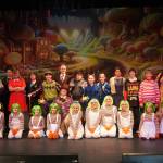 The cast of Seward High School Theatre Collectives Charlie and the Chocolate Factory appear for a photo on Thursday, April 3, 2025. (Jake Dye/Peninsula Clarion)