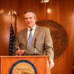 Gov. Mike Dunleavy (R-Alaska) speaks to reporters about his decision to veto an education funding bill at the Alaska State Capitol on Thursday, April 17, 2025. (Jasz Garrett / Juneau Empire)